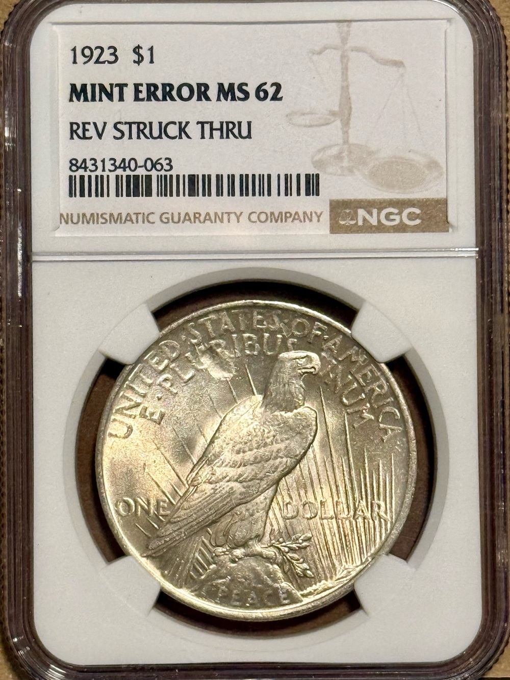 1923 Silver Peace Dollar, Mint Error: Reverse Struck Thru • Graded NGC MS62